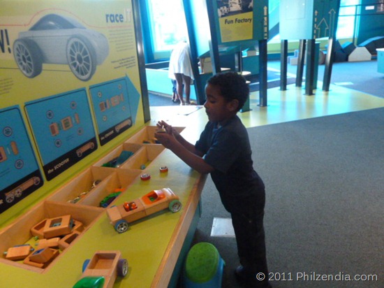 My son building Automoblox cars at Whitaker center of science