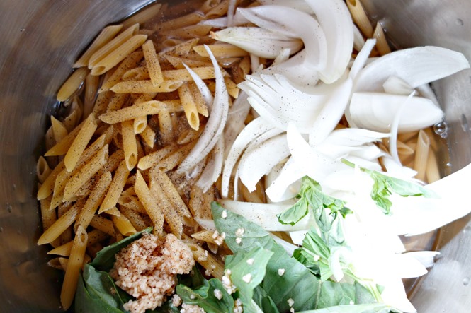 Adding ingredients to pot for one pot pasta