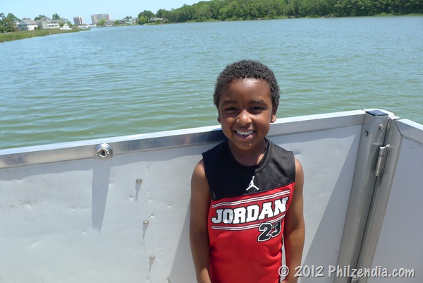 My son at the front of the pontoon boat
