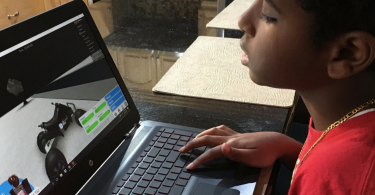 Playing video games on the new HP Omen gaming laptop available at Walmart